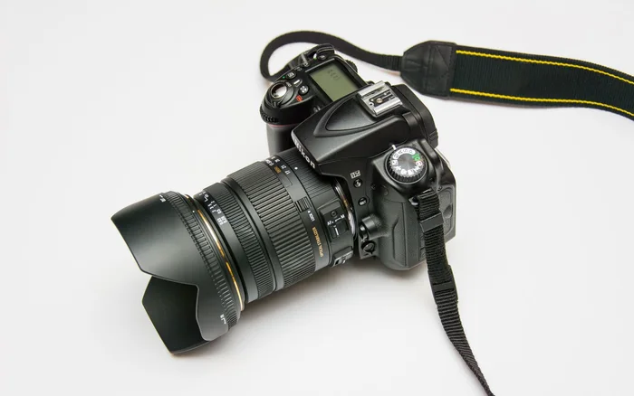 Close view of a camera lens, illustrating the editorial image workflow