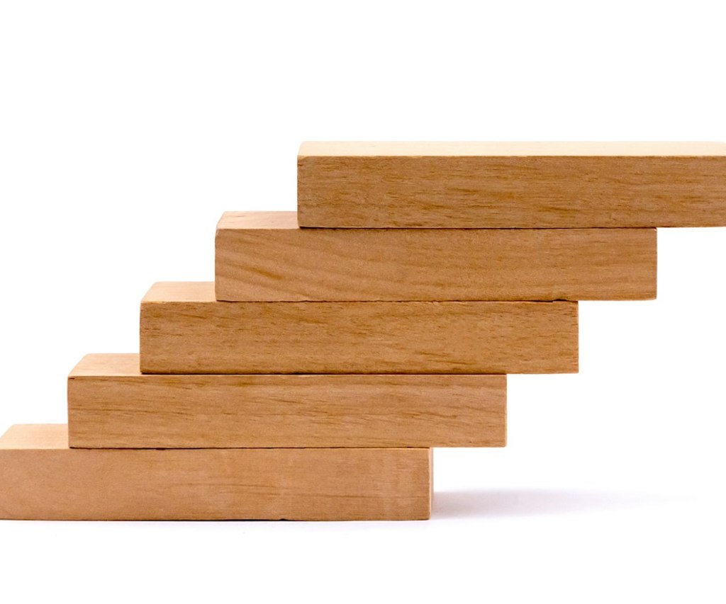 laying out wooden cubes